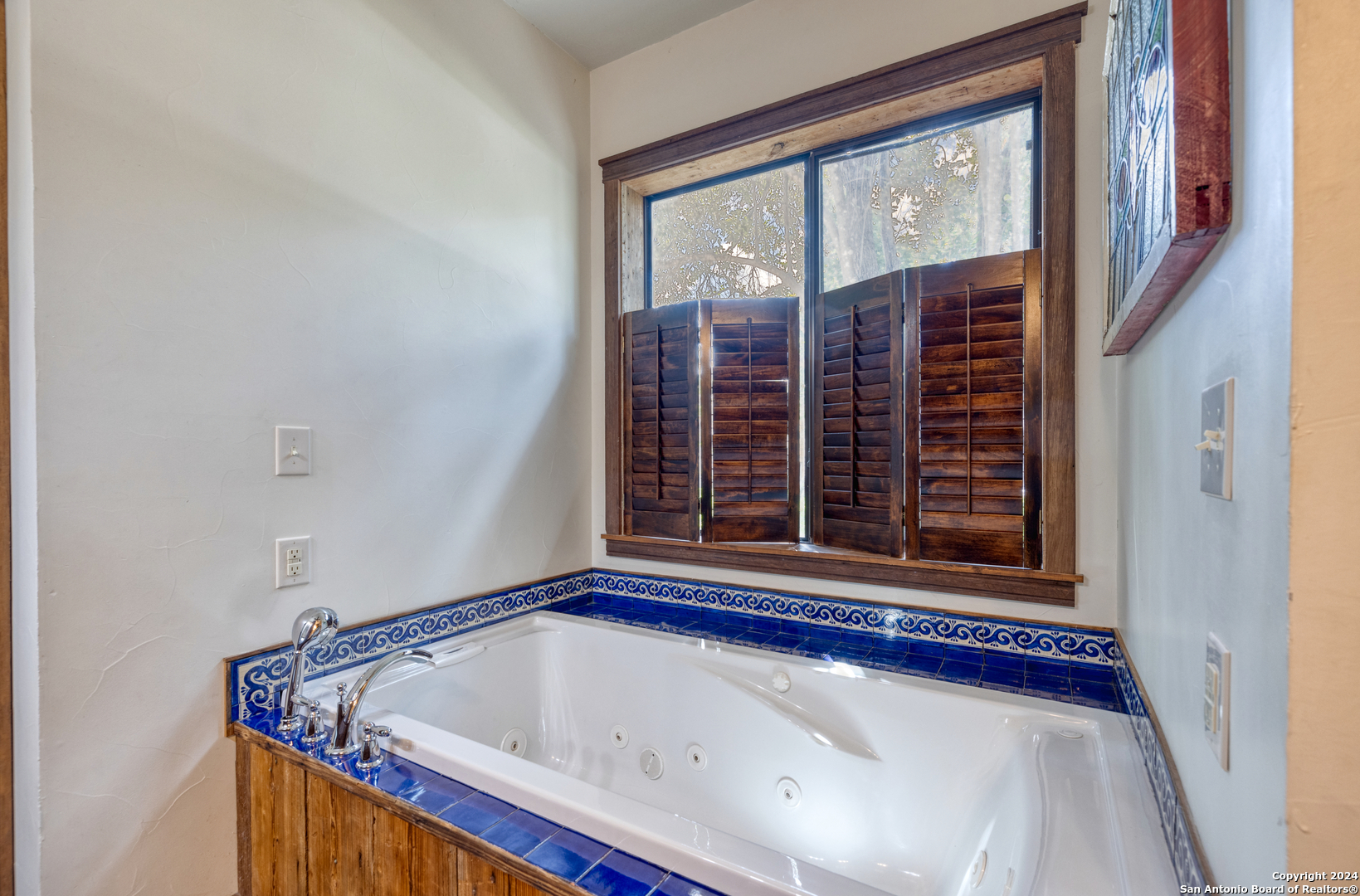 1242 River Road Concan, TX 78838 - Photo 17 of 42 a view of wooden floor and chair in a room