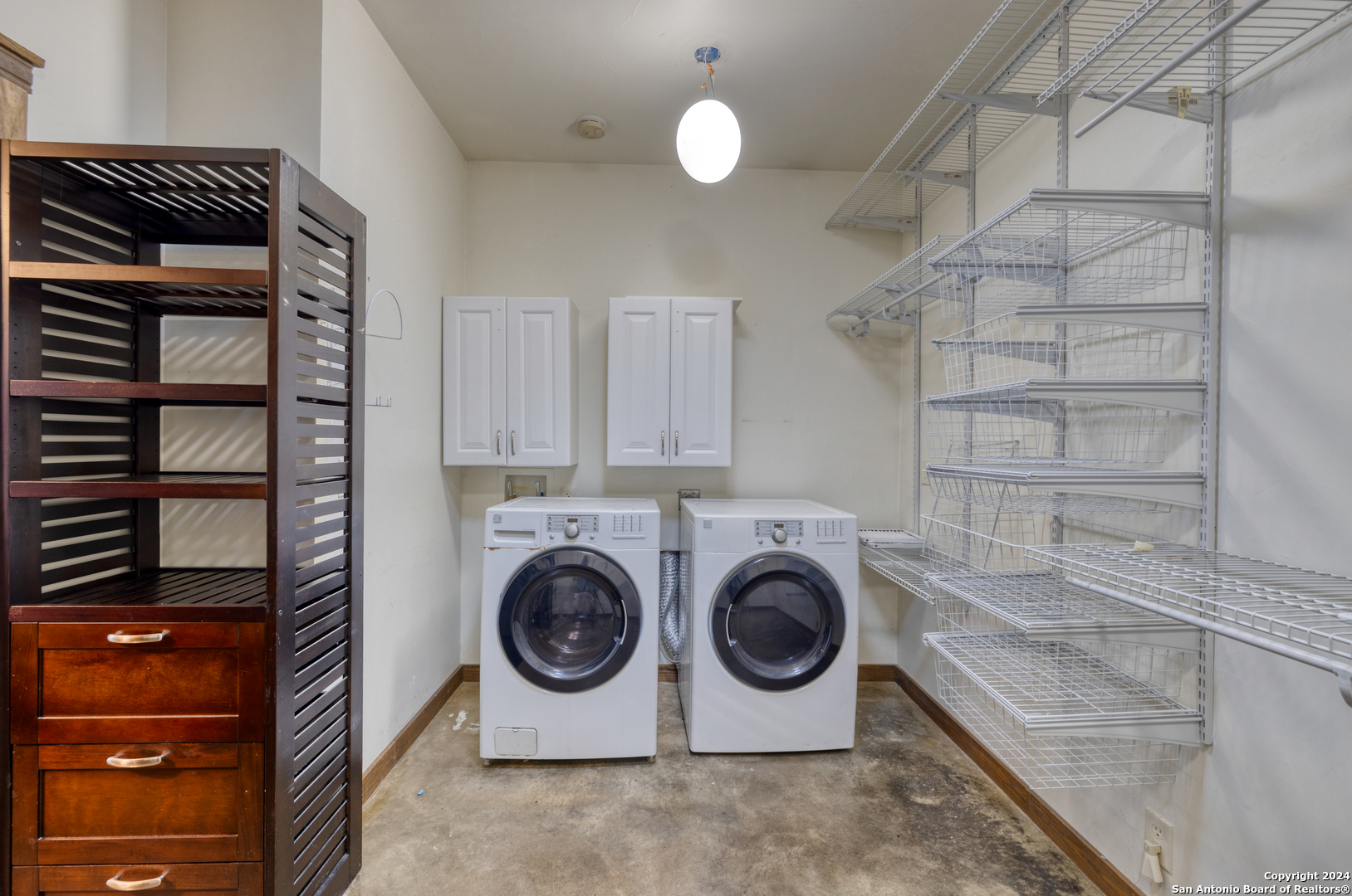 1242 River Road Concan, TX 78838 - Photo 19 of 42 a utility room with dryer and washer