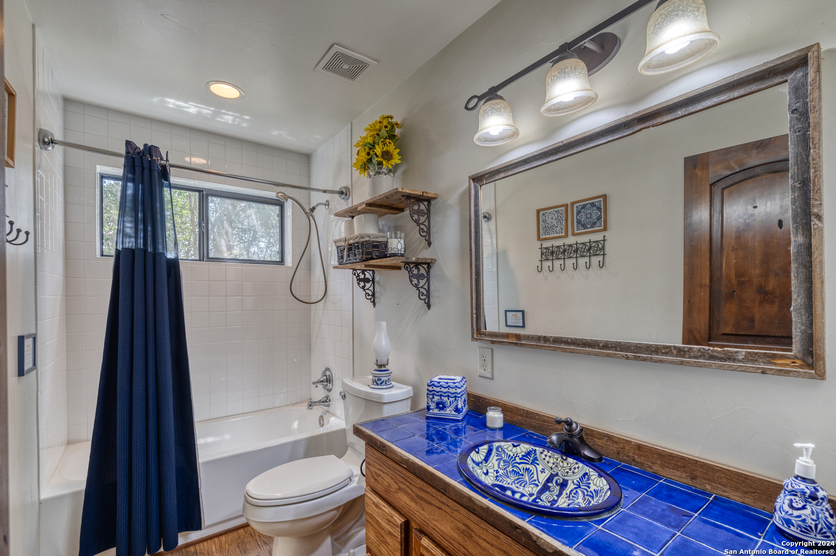 1242 River Road Concan, TX 78838 - Photo 20 of 42 a bathroom with a sink a toilet and shower