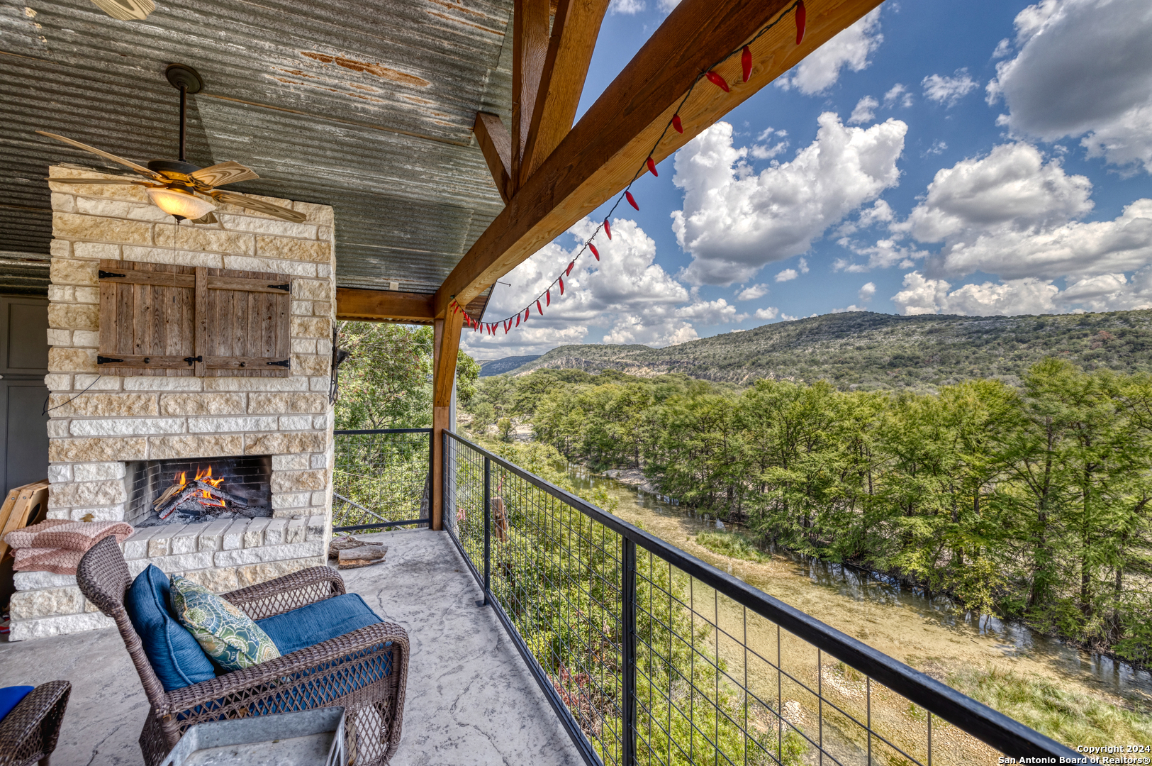 1242 River Road Concan, TX 78838 - Photo 35 of 42 a balcony with an outdoor seating