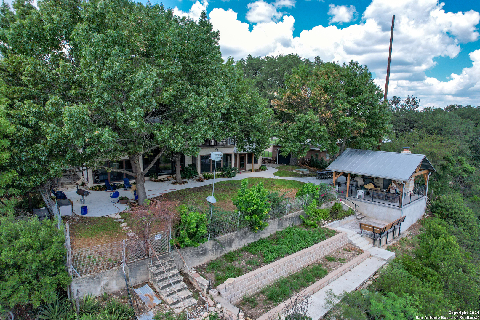 1242 River Road Concan, TX 78838 - Photo 37 of 42 a view of house with outdoor space and swimming pool