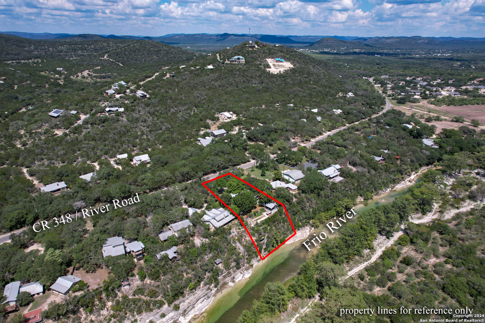 1242 River Road Concan, TX 78838 - Photo 42 of 42 an aerial view of residential houses with outdoor space