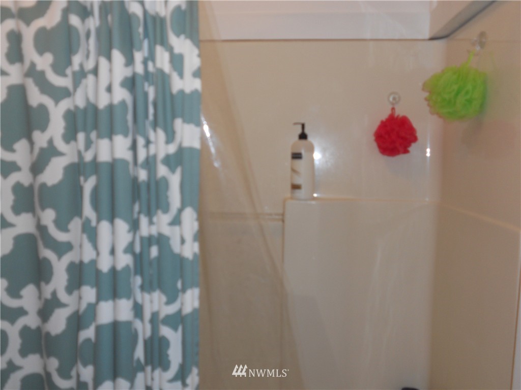705 North 88th Street Seattle, WA 98103 - Photo 11 of 22 a bathroom with a shower