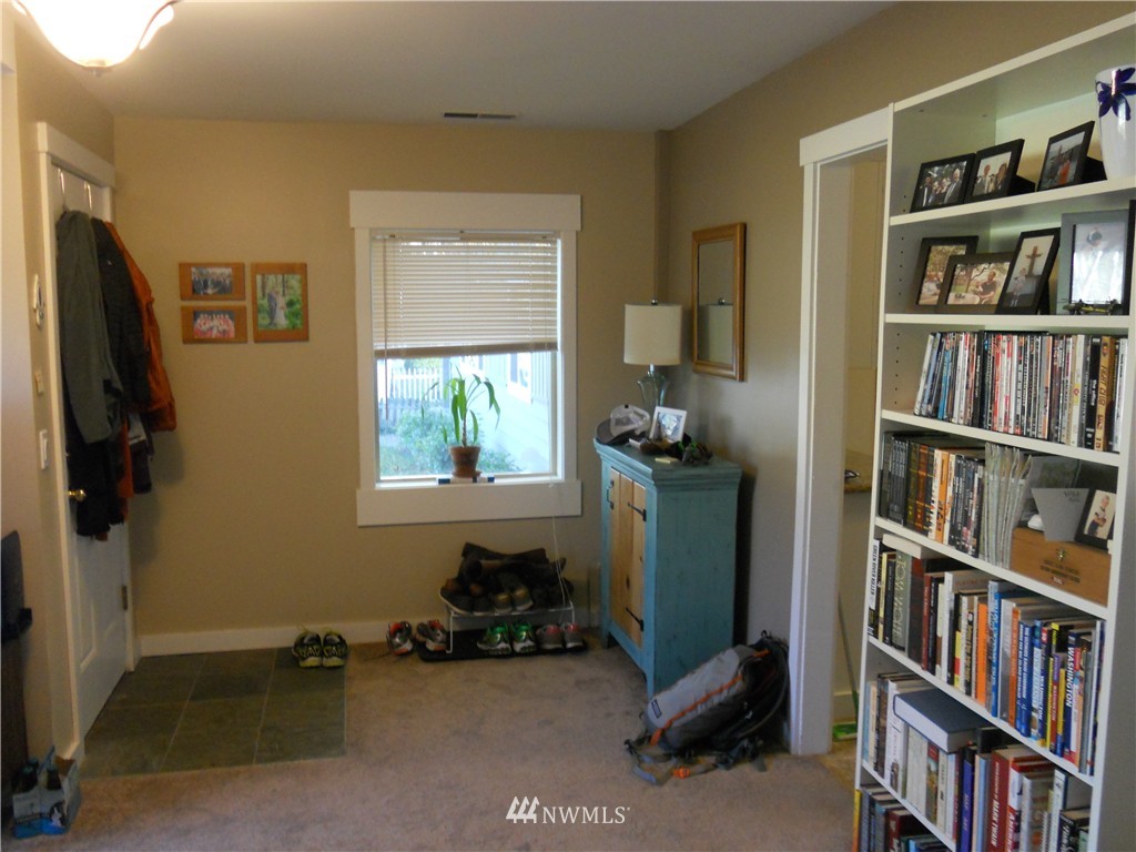 705 North 88th Street Seattle, WA 98103 - Photo 15 of 22 a room with furniture and a book shelf