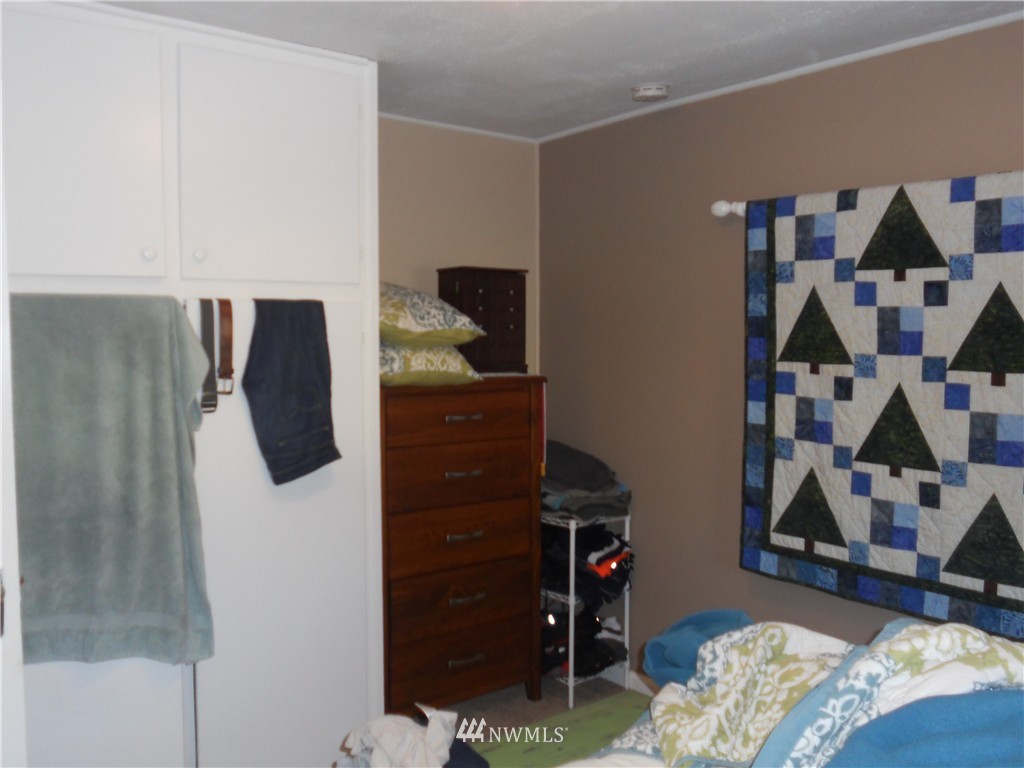 705 North 88th Street Seattle, WA 98103 - Photo 16 of 22 a bedroom with a bed and a closet