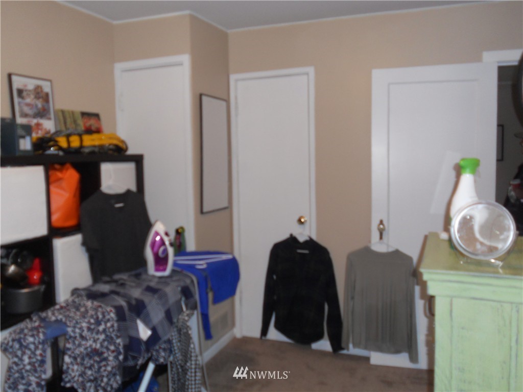705 North 88th Street Seattle, WA 98103 - Photo 18 of 22 a bedroom with a bed and wooden floor