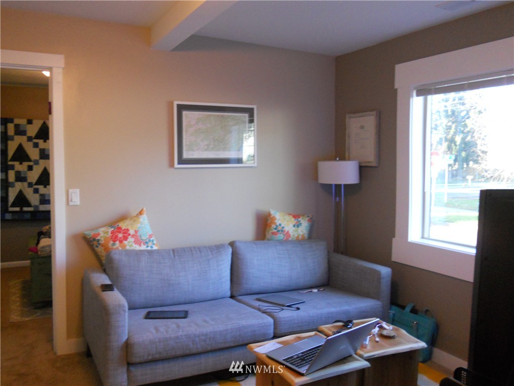 705 North 88th Street Seattle, WA 98103 - Photo 19 of 22 a living room with furniture and a window