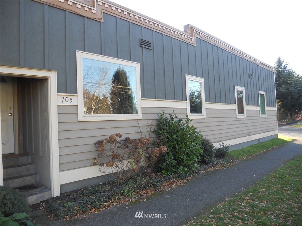 705 North 88th Street Seattle, WA 98103 - Photo 3 of 22 a view of a house with a yard