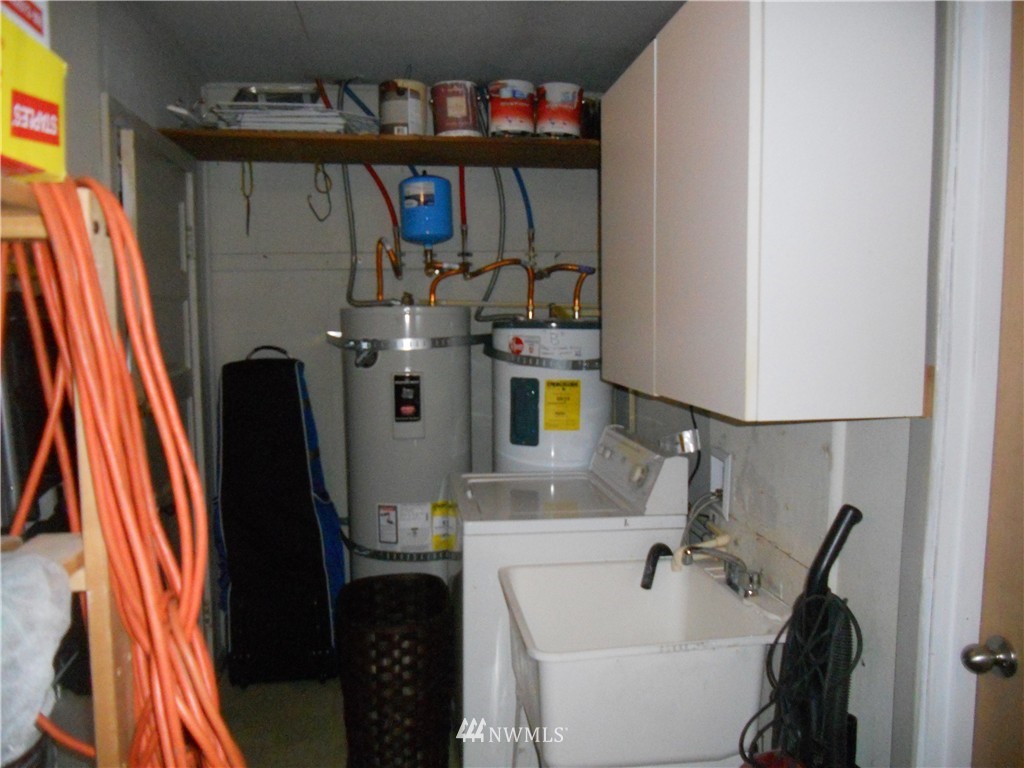 705 North 88th Street Seattle, WA 98103 - Photo 22 of 22 a view of walk in closet with clothes and shoes