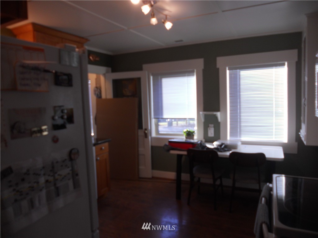 705 North 88th Street Seattle, WA 98103 - Photo 7 of 22 a view of a dining room with furniture and a window