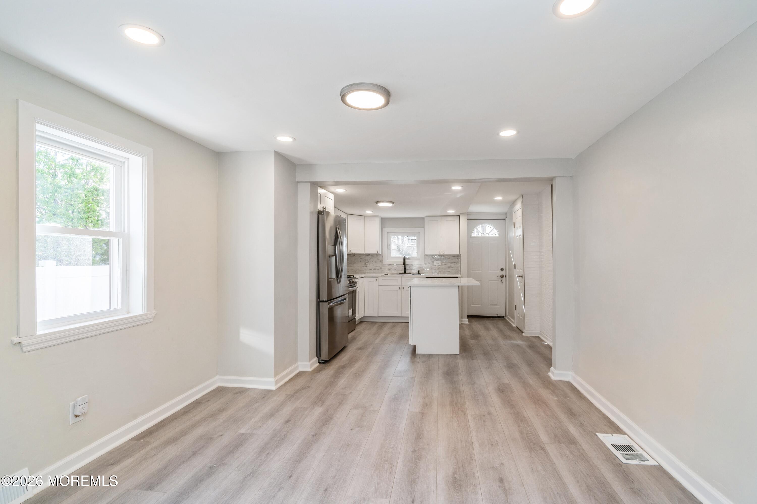 21 Mathiasen Place, Unit A Matawan, NJ 07747 - Photo 4 of 12 a view of a kitchen with wooden floor