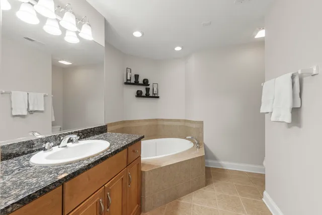 a bedroom with furniture and windows