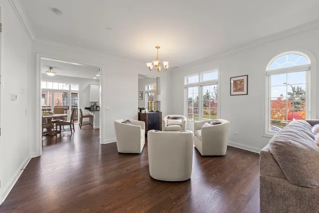 a kitchen with a table chairs a sink dishwasher window and cabinets