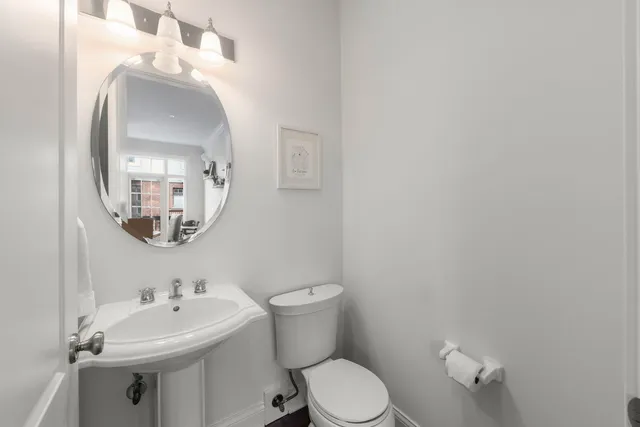 a spacious bedroom with a bed and a cabinets