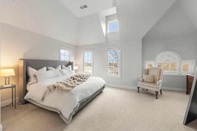 a bathroom with a granite countertop sink a mirror and shower