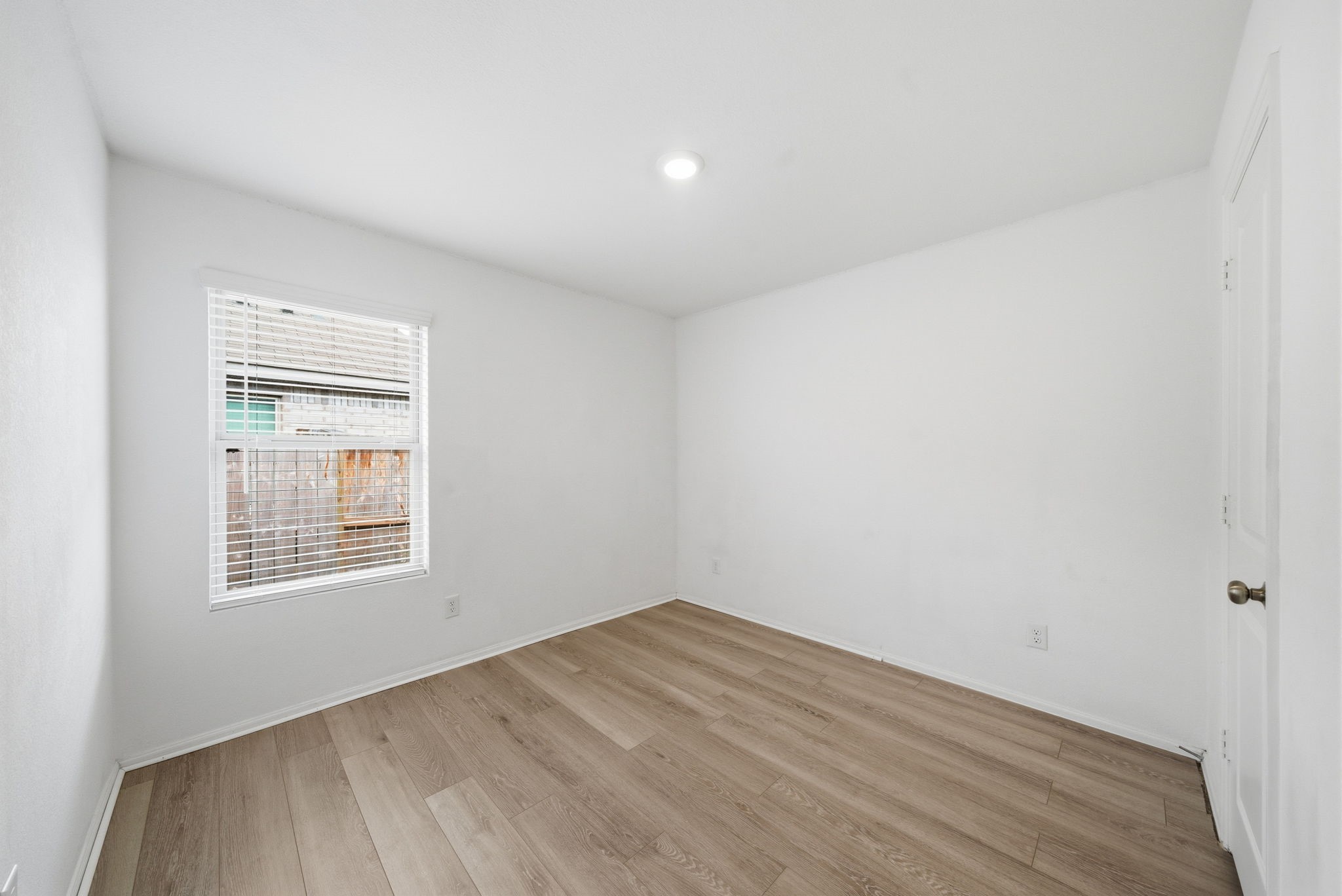 7335 Greenbriar Cyn Lane Katy, TX 77493 - Photo 6 of 10 an empty room with a window