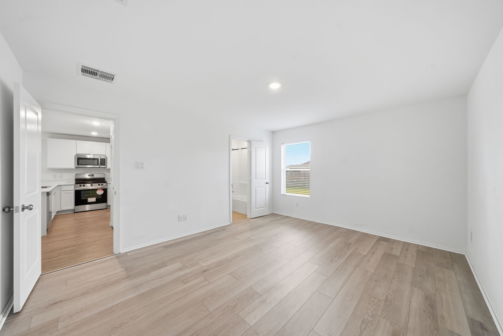 7335 Greenbriar Cyn Lane Katy, TX 77493 - Photo 7 of 10 wooden floor in an empty room
