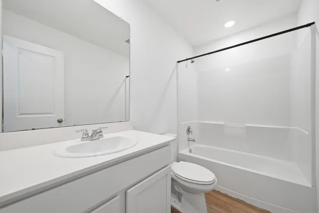 a bathroom with a sink toilet and a bathtub