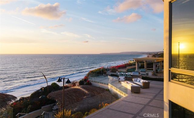 a kitchen with granite countertop a sink a counter top space appliances and cabinets