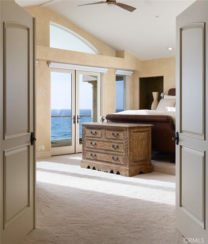 a bed room with a bed and a large window