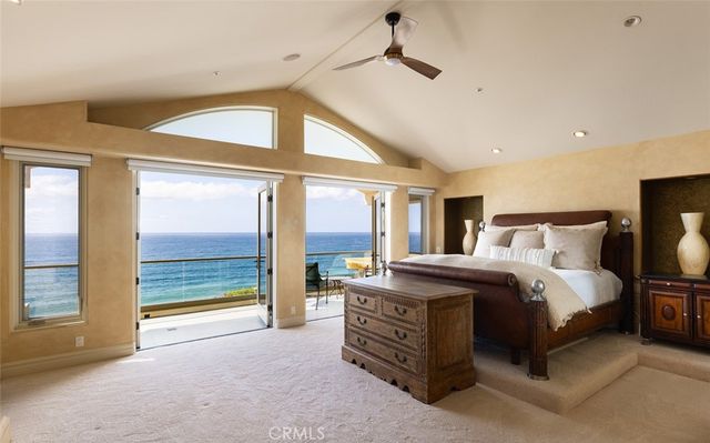 a bedroom with a bed and a fireplace