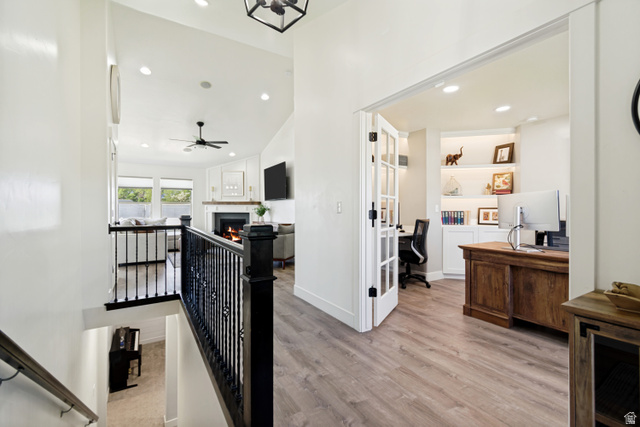 983 West 1550th Street South Springville, UT 84663 - Photo 7 of 43 Open office space featuring French doors, recessed lighting, and built-in shelving with accent lighting.