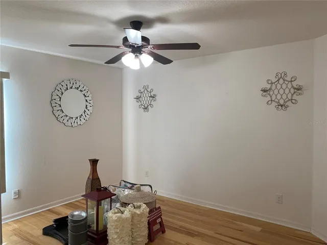 a view of a room with a fan