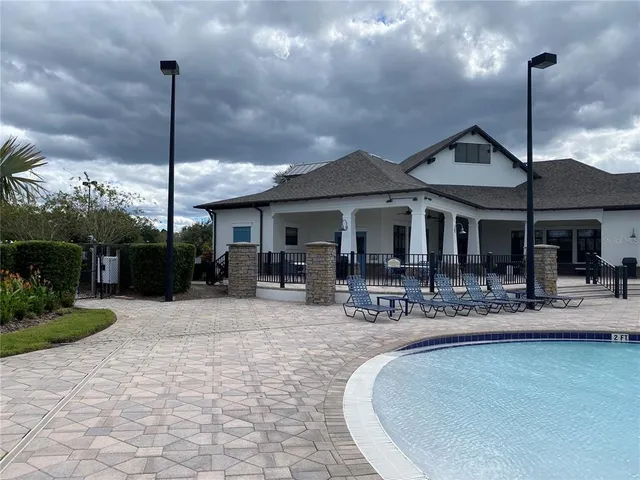 a patio with a table and chairs