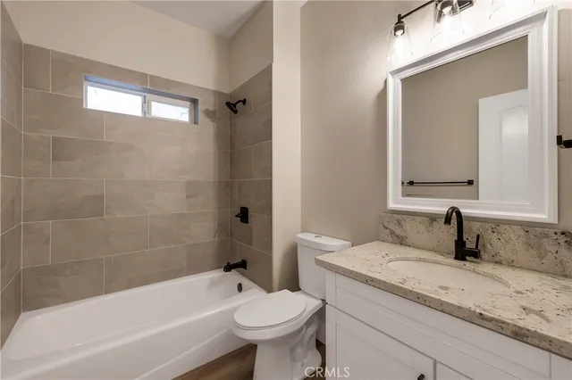 a bathroom with a sink toilet and bathtub