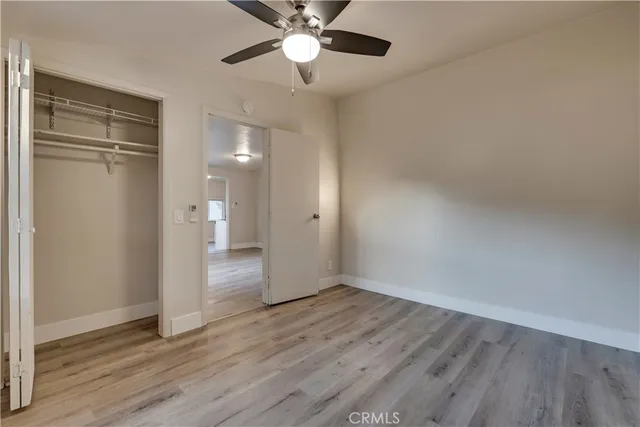 a view of living room with furniture and wooden floor