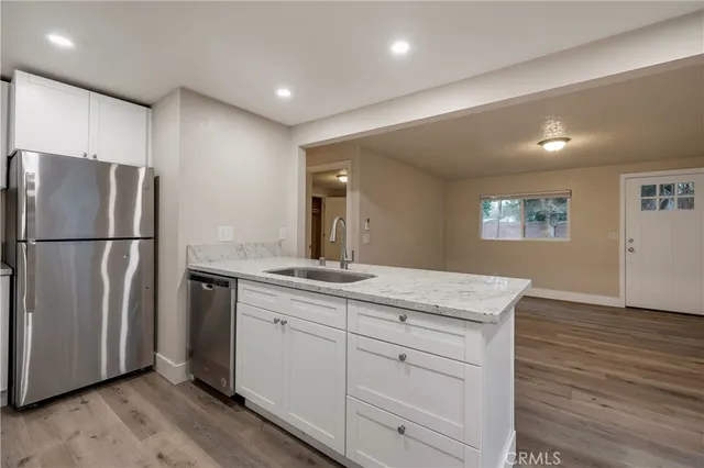 a kitchen with a stove microwave and refrigerator