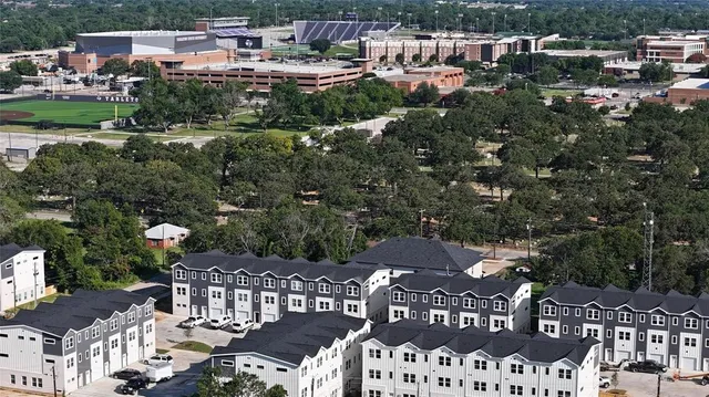 a view of city from balcony with outdoor seating