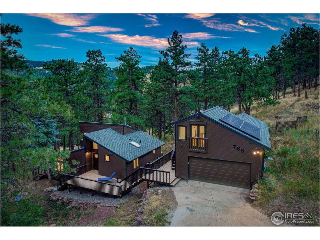 765 Pine Brook Road Boulder, CO 80304 - Photo 1 of 37 a view of a deck with a garden