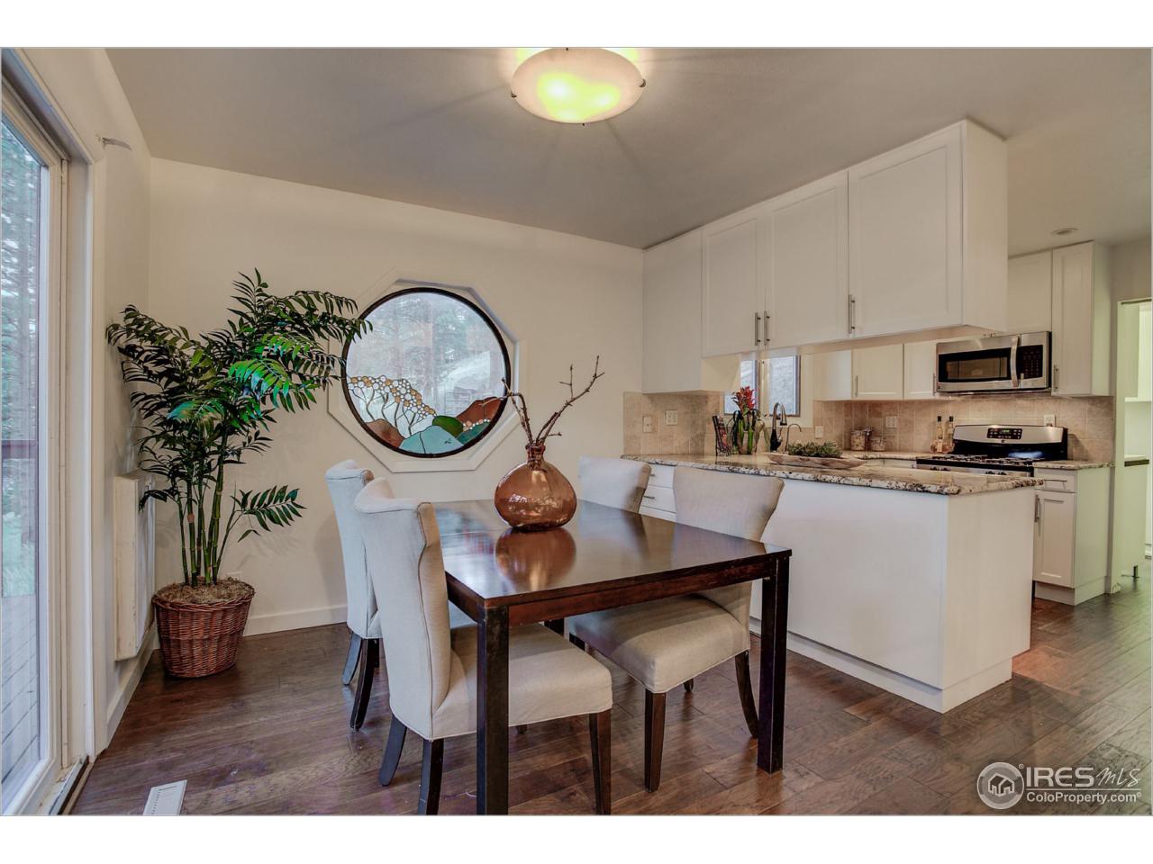 765 Pine Brook Road Boulder, CO 80304 - Photo 14 of 37 a kitchen with a table and chairs