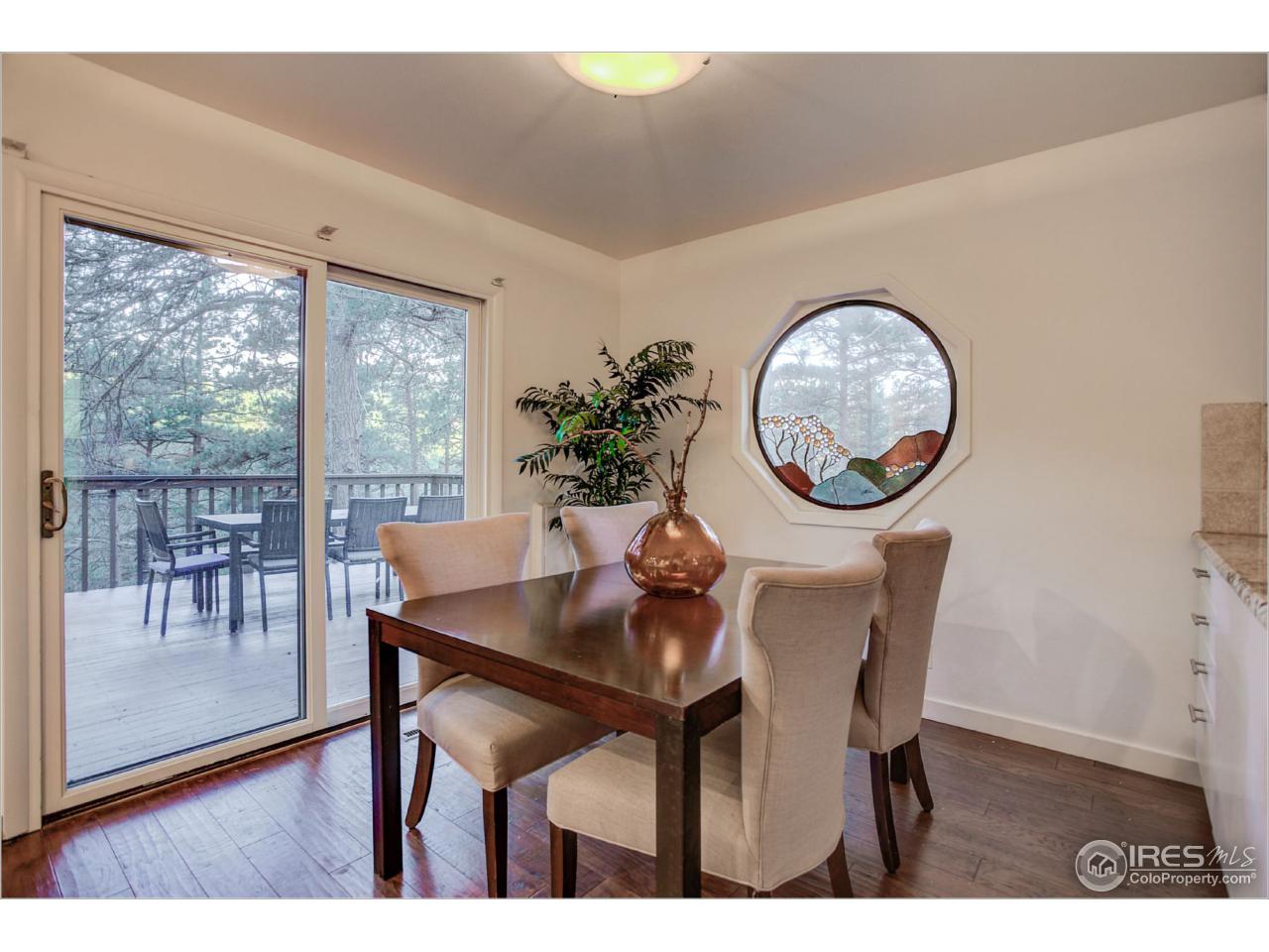 765 Pine Brook Road Boulder, CO 80304 - Photo 15 of 37 a view of a dining room with furniture window and wooden floor