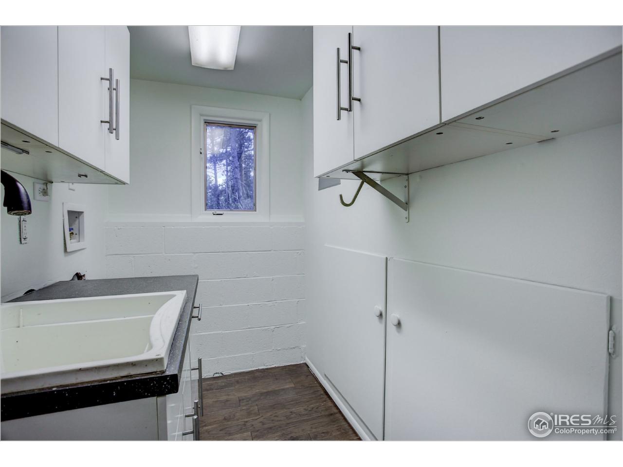 765 Pine Brook Road Boulder, CO 80304 - Photo 20 of 37 a bathroom with a sink and a mirror