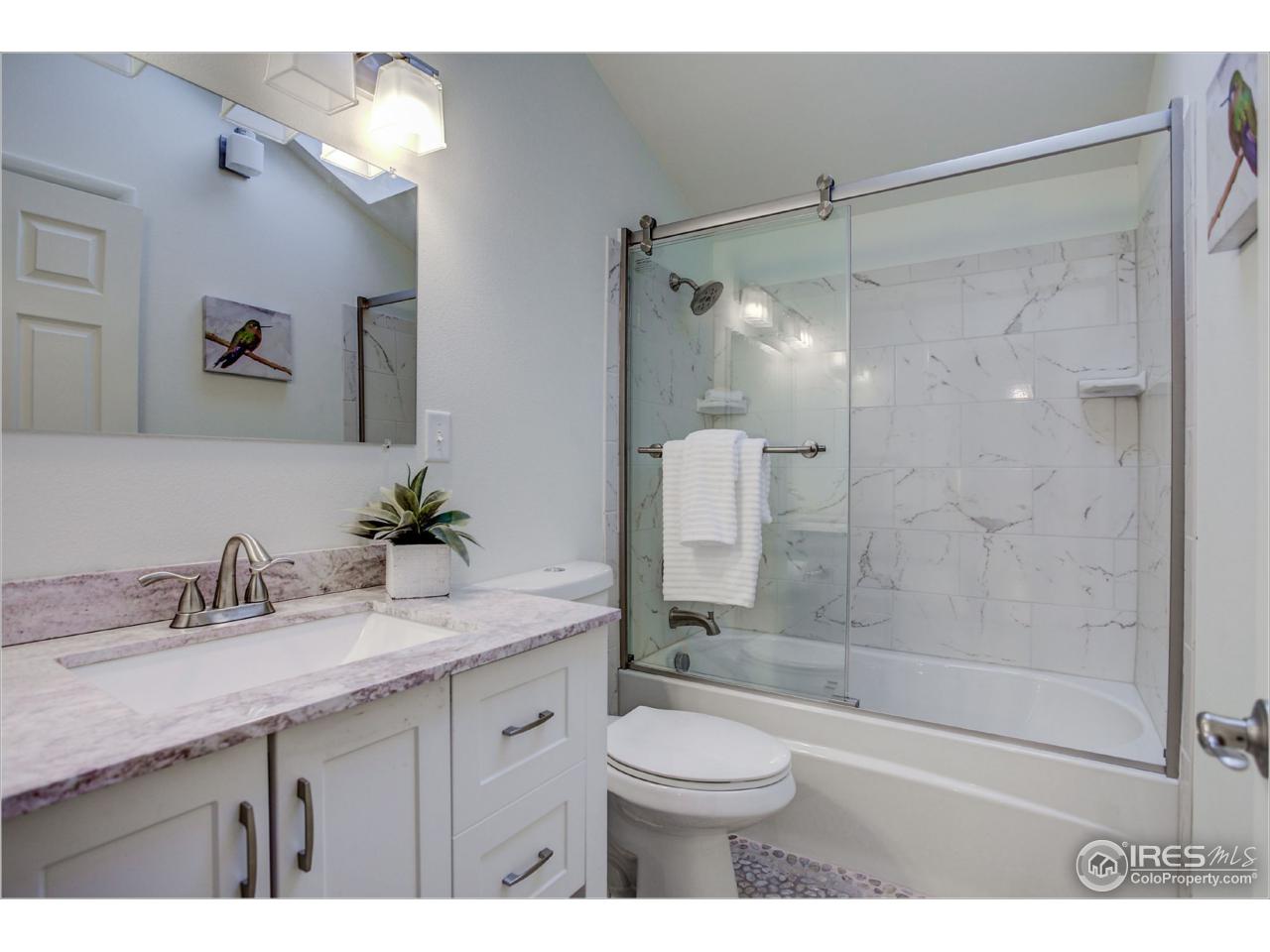 765 Pine Brook Road Boulder, CO 80304 - Photo 30 of 37 a bathroom with a sink a toilet and shower