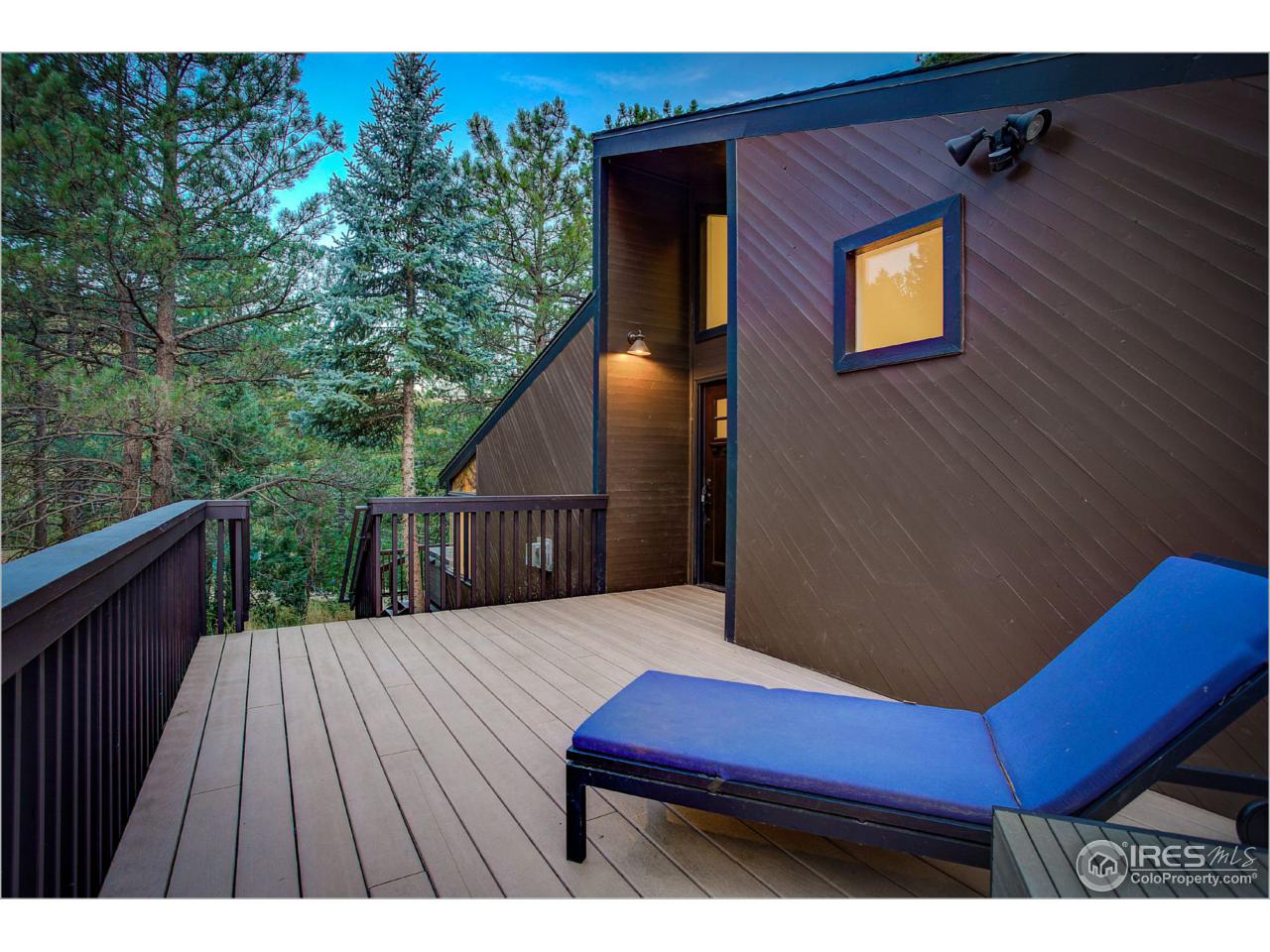 765 Pine Brook Road Boulder, CO 80304 - Photo 3 of 37 a view of a wooden deck and a yard