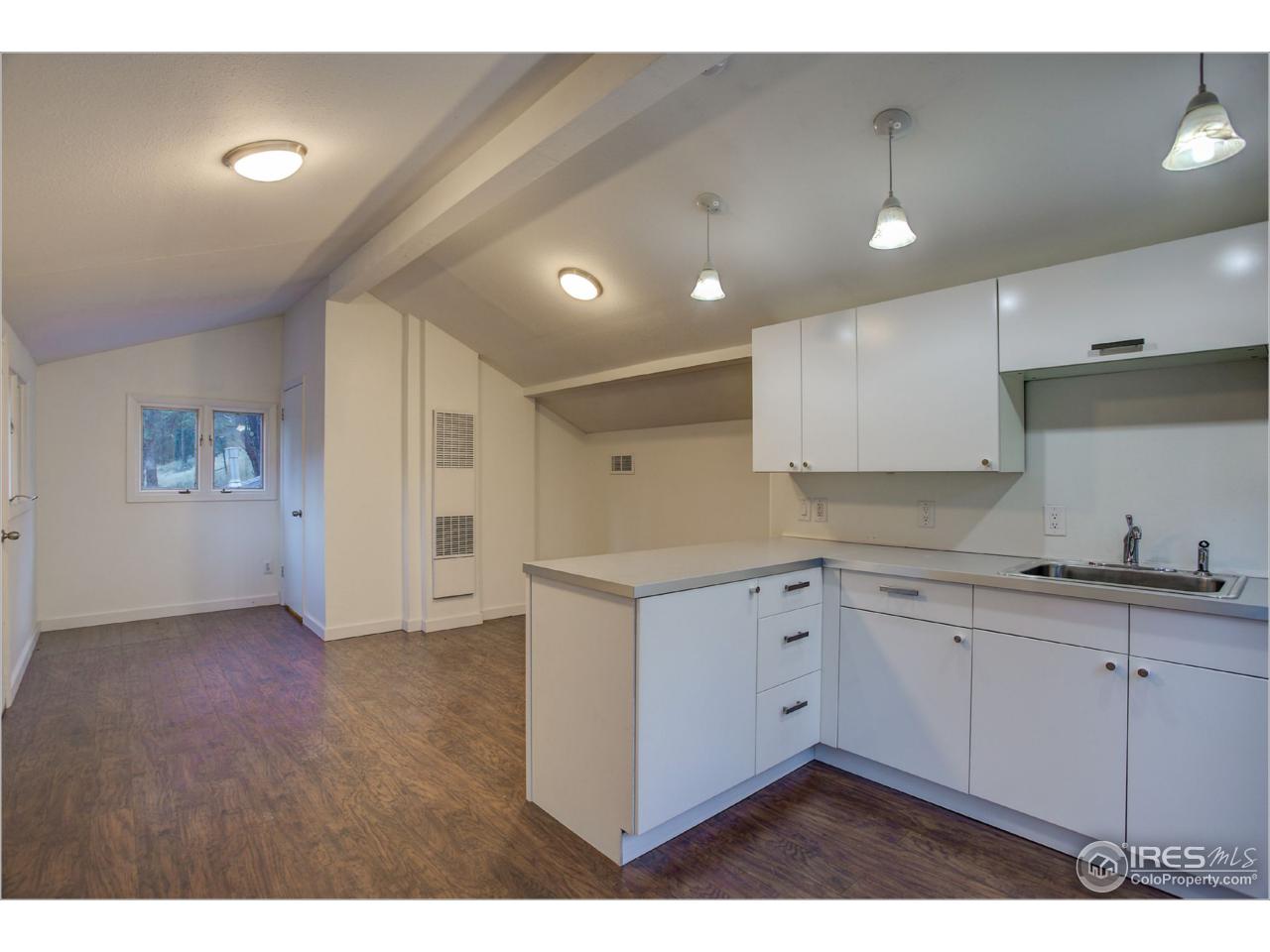765 Pine Brook Road Boulder, CO 80304 - Photo 33 of 37 a kitchen with white cabinets