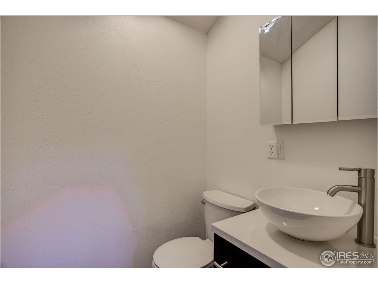 765 Pine Brook Road Boulder, CO 80304 - Photo 36 of 37 a bathroom with a toilet