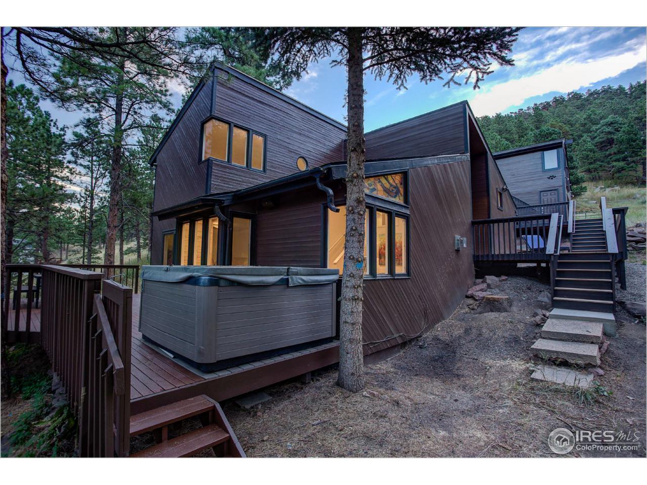 765 Pine Brook Road Boulder, CO 80304 - Photo 8 of 37 a backyard of a house with barbeque oven and outdoor seating