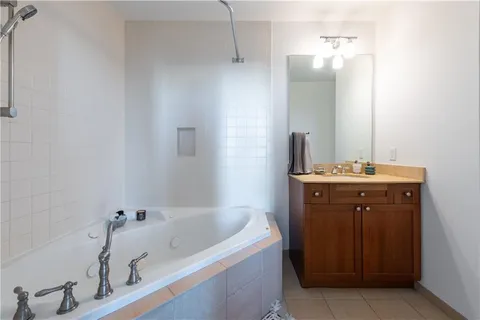 a bathroom with a bathtub and a sink