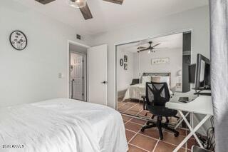 115 West 10th Street Tempe, AZ 85281 - Photo 12 of 19 a bedroom with a bed and a table in it