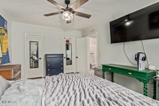 115 West 10th Street Tempe, AZ 85281 - Photo 14 of 19 a bedroom with a bed and a flat screen tv