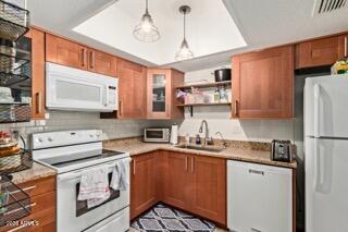 115 West 10th Street Tempe, AZ 85281 - Photo 3 of 19 a kitchen with a sink stove and refrigerator