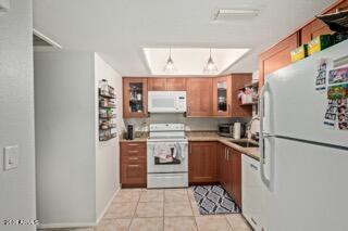 115 West 10th Street Tempe, AZ 85281 - Photo 4 of 19 a kitchen with stainless steel appliances granite countertop a refrigerator and a stove