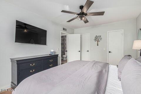 115 West 10th Street Tempe, AZ 85281 - Photo 8 of 19 a bedroom with a bed and a flat screen tv