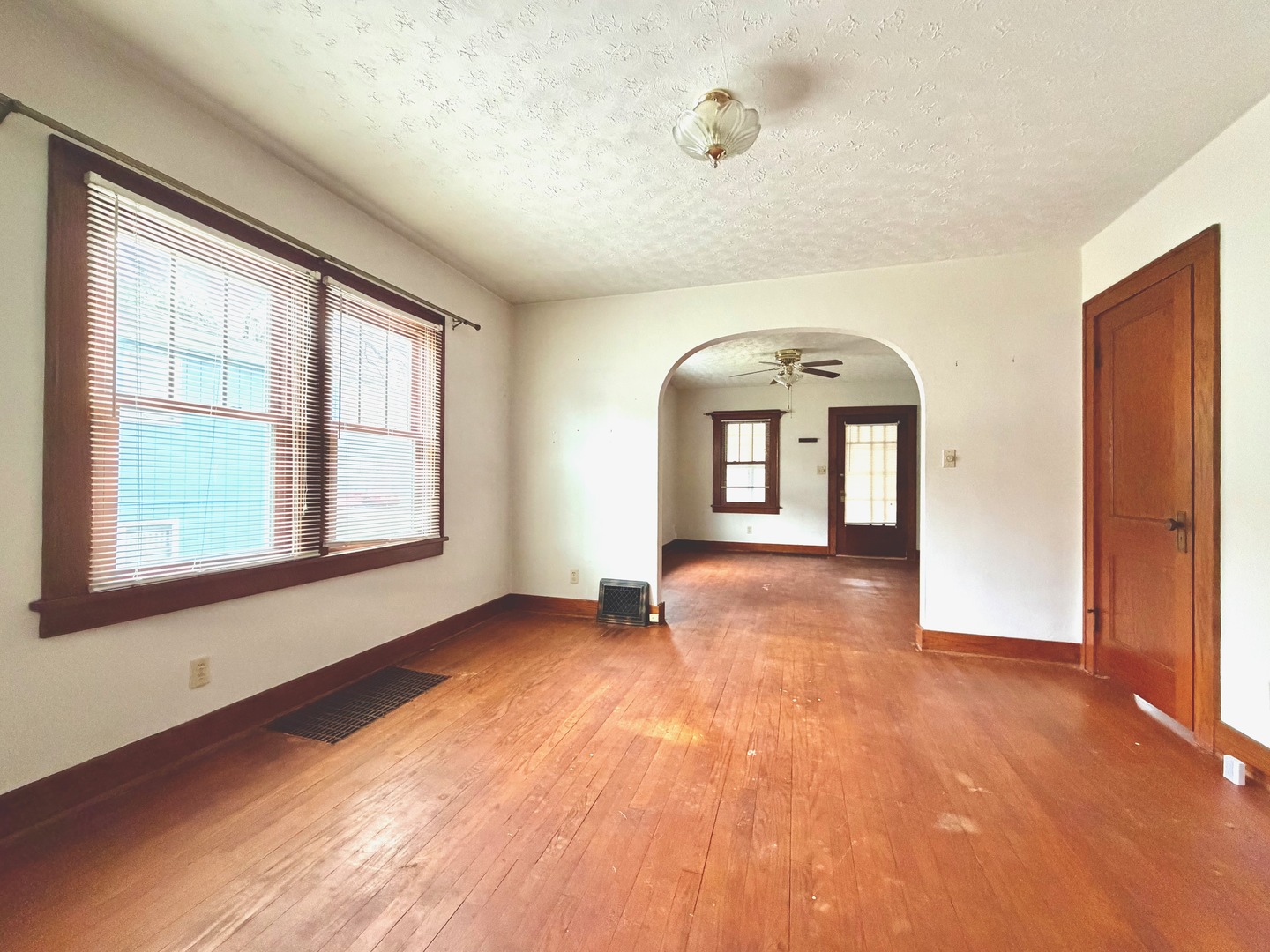 422 45th Street Moline, IL 61265 - Photo 6 of 22 an empty room with wooden floor and windows