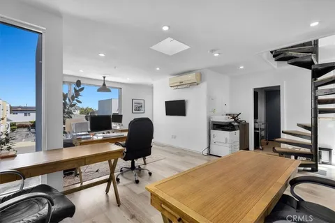 a room with furniture and a flat screen tv