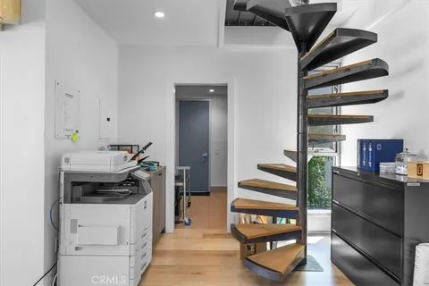 a kitchen with a refrigerator and a stove